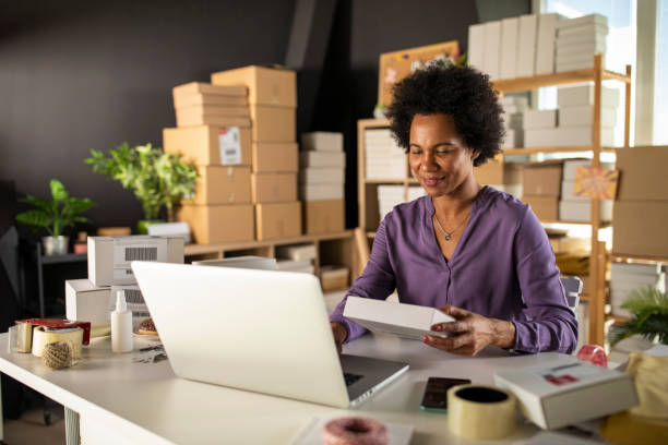 istock Entering customer's info in laptop to check data on the package 1302478886