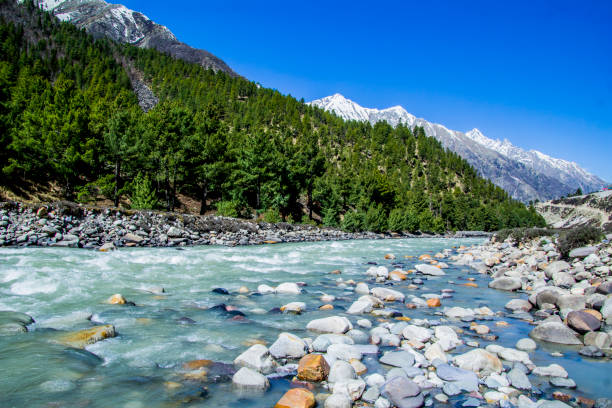 Beautiful River flowing though Chitkul Chitkul is a village in Kinnaur district of Himachal Pradesh. During winters, the place mostly remains covered with the snow and the inhabitants move to lower regions of Himachal. According to a recent study by Centre of Atmospheric Sciences at IIT Delhi, Chitkul has the cleanest air in India himachal pradesh photos stock pictures, royalty-free photos & images