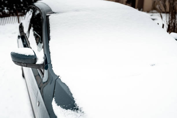 istock Front view of a frozen car covered in snow 1302479050