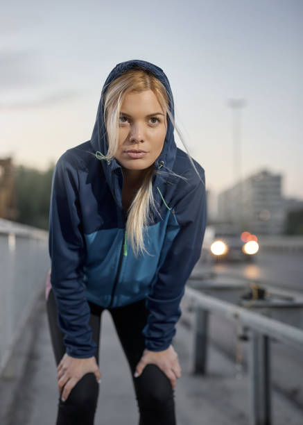istock A young and beautiful female athlete resting body. 1302479174