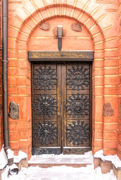 Antique wooden door and arched passage