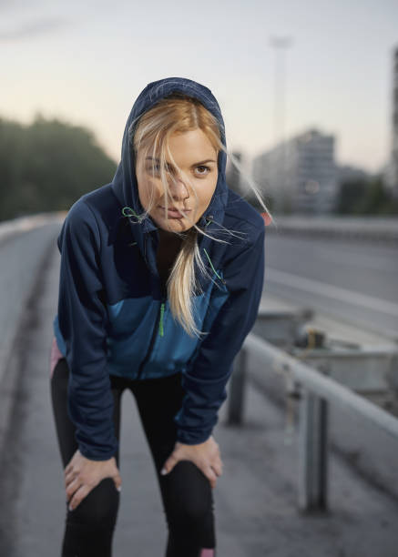istock A young and beautiful female athlete resting body. 1302479667