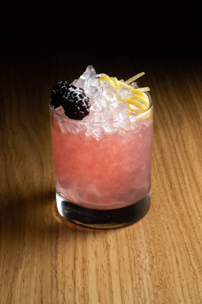 istock Bramble is an alcoholic cocktail based on gin, blackberry liqueur, lemon juice. 1302480976