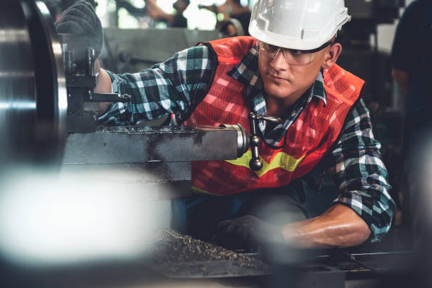 istock Smart factory worker or engineer do machine job in a manufacturing workshop 1302481813