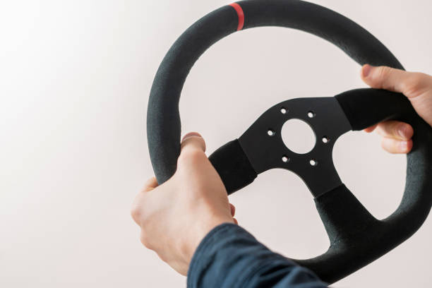 istock simple abstract car steering wheel, hands driving vehicle 1302482217