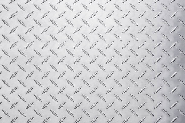 istock metallic steel plate with diamond pattern. light silver metal background 1302483404