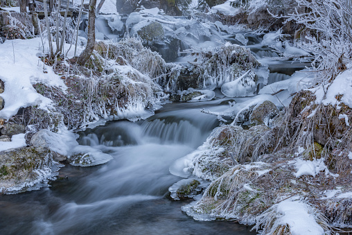 Ramsaubach creek near Ramsau ski town in Austria in very cold frosty morning