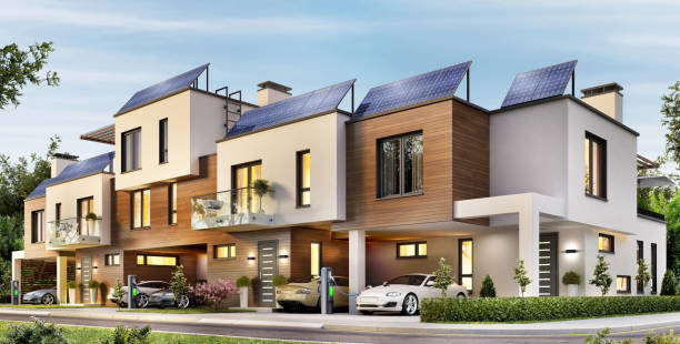 Modern house with a terrace and solar panels on the roof House with a terrace and solar panels on the roof. Electric cars on charging townhouse stock pictures, royalty-free photos & images