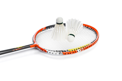 Badminton rackets and feather shuttlecocks isolated on white background