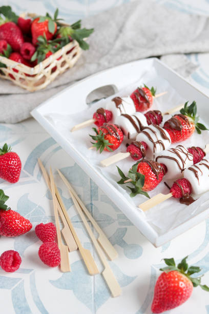 istock Dessert Skewers with Marshmallows Strawberries and Chocolate 1302487619