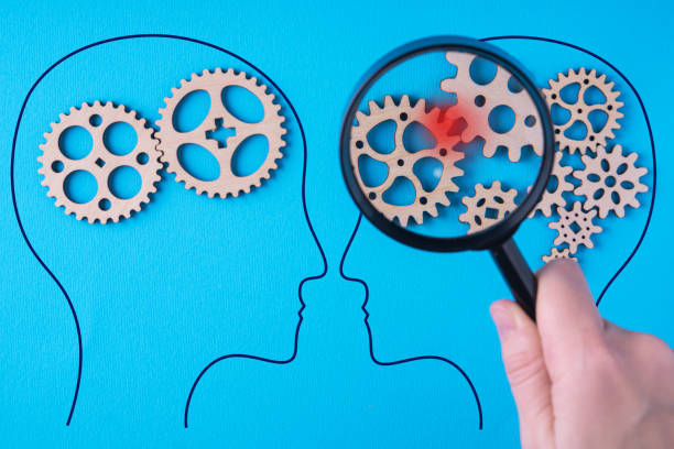 istock Human brain is made gear mechanism. The brain is viewed through a magnifying glass. Brain damage concept. 1302488281