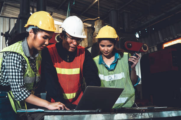 istock Factory job workers working and discussing manufacturing plan in the factory 1302490328