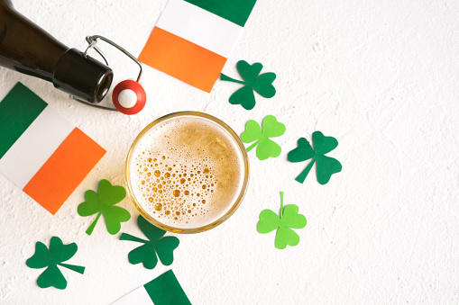 St. Patrick's Day Celebration. Beer decorated with Irish flags and shamrocks. Copy space. Top view.