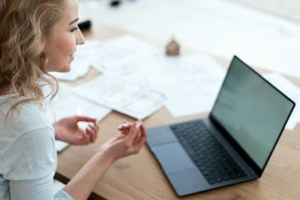 istock Woman working in office, making video call 1302491346