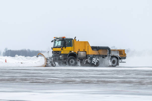 istock Snowblower cleans airport apron in a snowstorm 1302491378