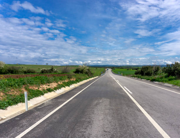 istock White bus traveling on the road 1302491710