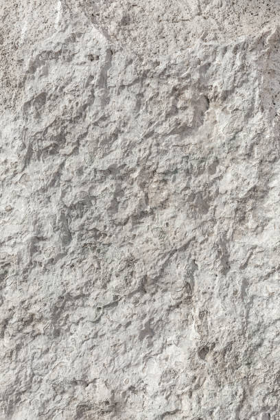 istock Empty rough, uneven texture of a gray concrete wall close up with copy space 1302491720