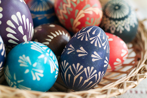 Mix of colored hand painted easter eggs with the traditional designs.