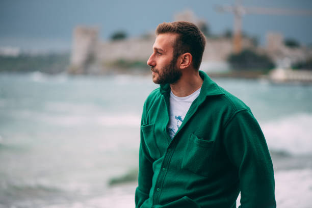 Man Watching the Sea in Windy Weather