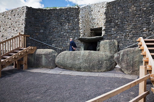 County Meath, Ireland - June 1, 2016. Tourist at the entrance to Newgrange in County Meath, it was built during the Neolithic period, around 3200 BC.