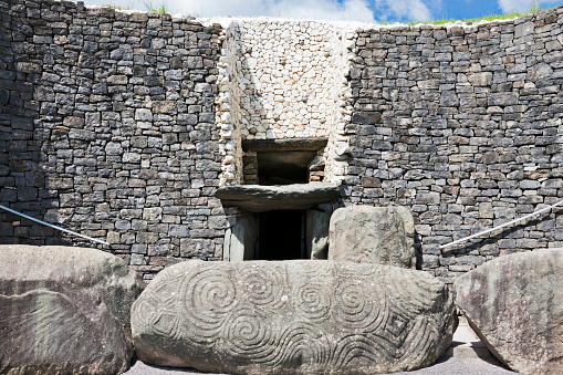 County Meath, Ireland - June 1, 2016. The entrance to Newgrange in County Meath, it was built during the Neolithic period, around 3200 BC.