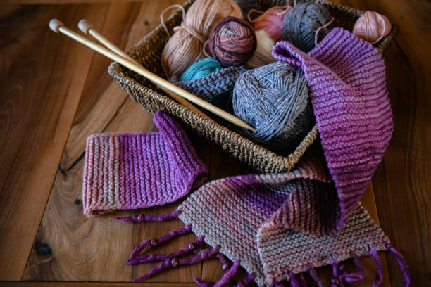 istock Accessories for knitting in basket ( yarn, needles) and scarf 1302494466
