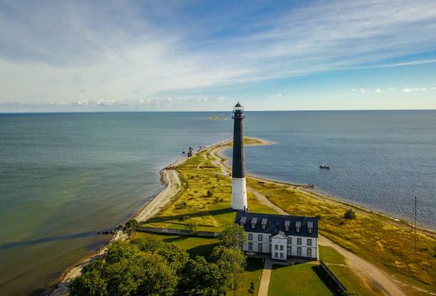 Lighthouse on the Sõrve Peninsula on the island of Saaremaa The image shows the lighthouse located on the southern tip of the peninsula on the island of Saaremaa , aerial view Saaremaa Island stock pictures, royalty-free photos & images
