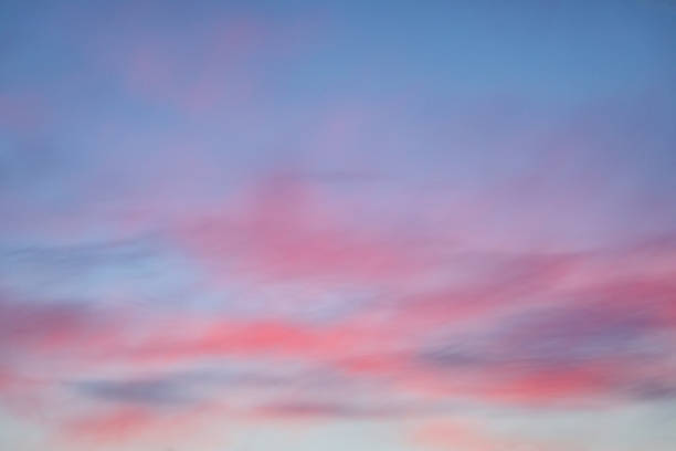 istock Beautiful pastel sunset with colorful clouds on the blue sky 1302495262