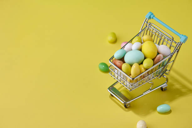 istock Colorful Easter sweets in shopping basket 1302496298