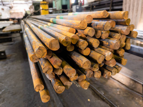 istock rusted long round steel bars pack - close-up with selective focus 1302497714