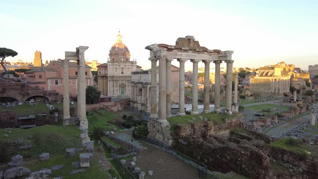 Wonderful panoramic sunset in ancient Roman Forum with ruin of famous Temple and building