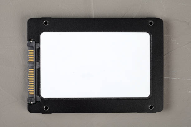 istock ssd hard drive on a concrete background, close-up, top view. 1302498981