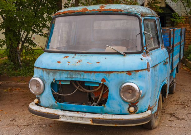 istock An old rotten blue car with a body. 1302499738