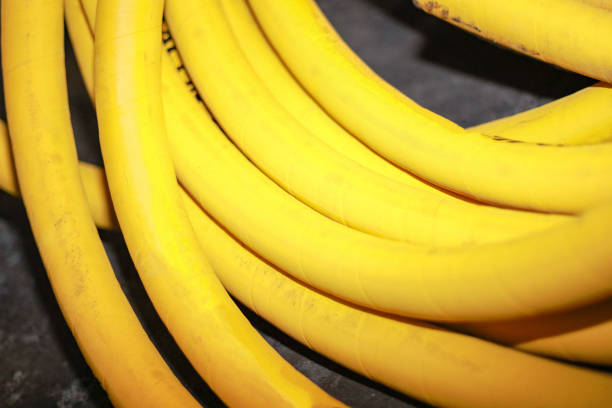 The yellow hose tube is coiled into a bundle. Close-up