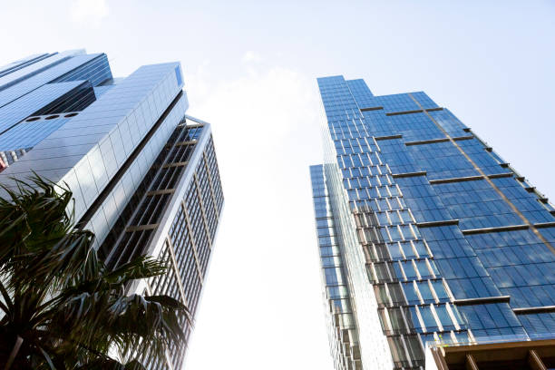 istock Low angle view of modern office buildings, skyscrapers, sky background with copy space 1302501231