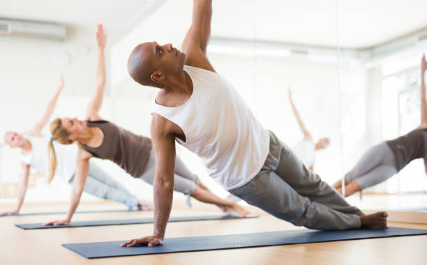 istock Group lesson on hatha yoga in studio 1302501242