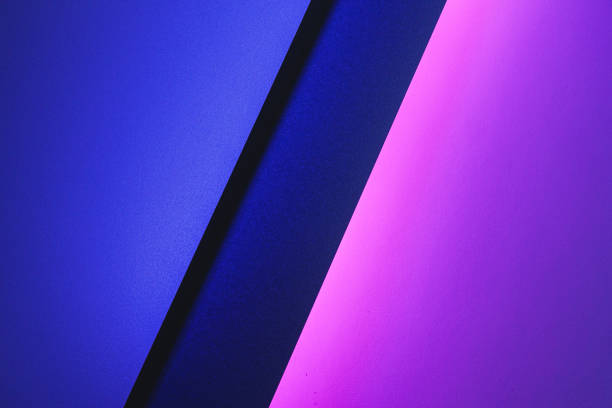 istock Blank paper sheets rolled in a neon purple lighting 1302503444
