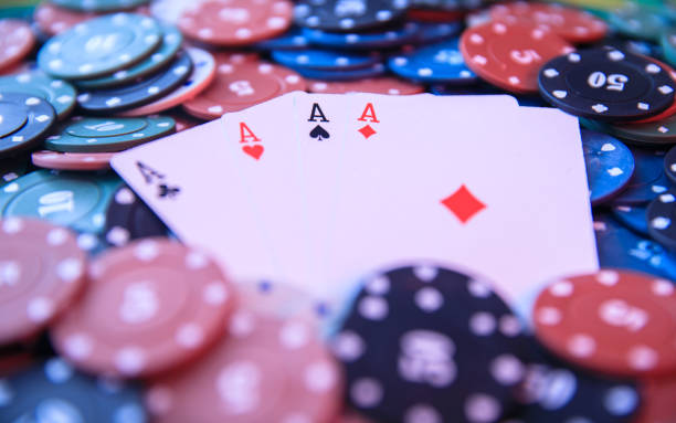 istock Pair of aces with poker chips 1302503903