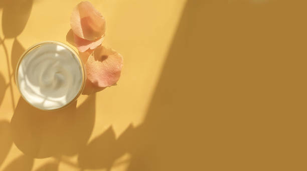 istock cream cosmetic rose flower on a colored background 1302504676