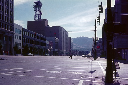 Salt Lake City, Utah, USA, 1970. Crossing at the Main Street in Salt Lake City. Furthermore: Pedestrian, buildings, shops and parked cars.