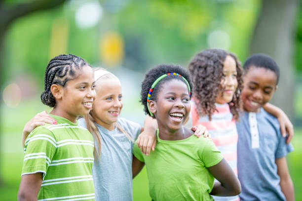 istock Multi ethnic group of children outdoors together 1302507265