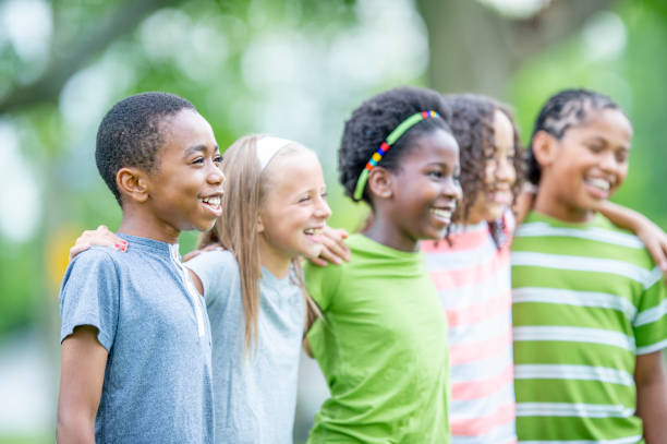istock Multi ethnic group of children outdoors together 1302507266
