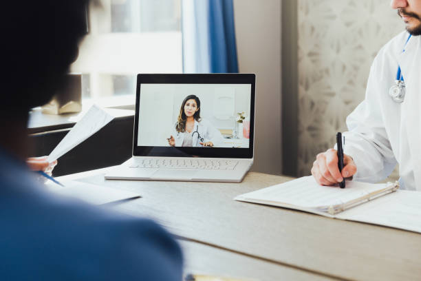 istock Female doctor participates in virtual meeting 1302507322