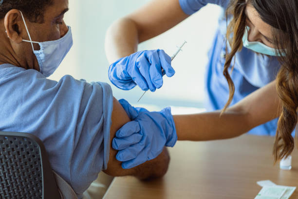 istock Patient receiving COVID-19 vaccine 1302507686
