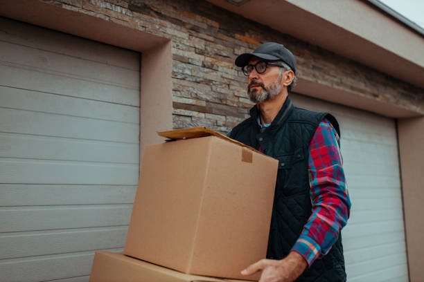 istock Delivery man making a delivery to a customer's home 1302508932