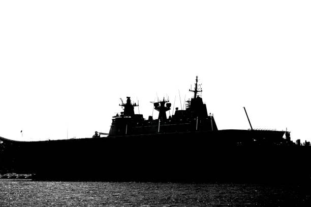 istock Black and white silhouette of Navy ship, background with copy space 1302509893
