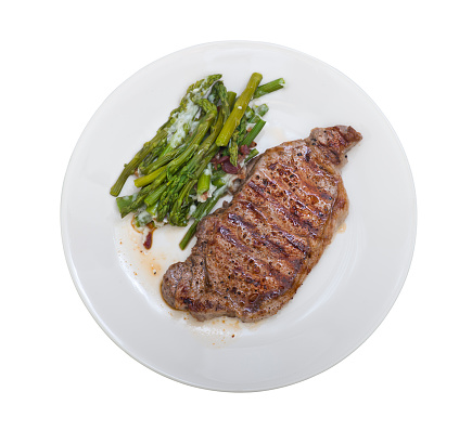 Grilled Beef Steak with asparagus in a white plate