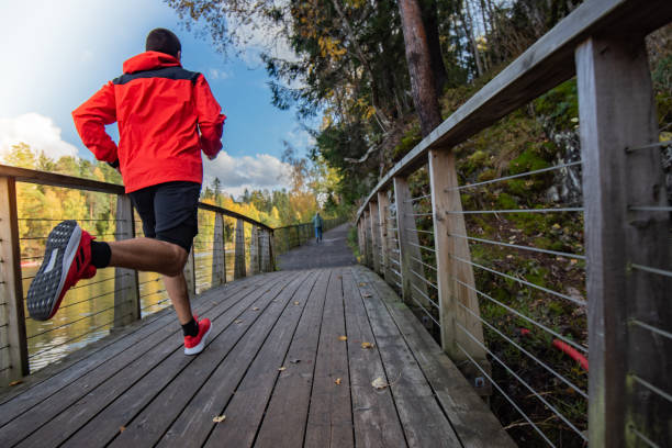 istock Sportsman running on bridge in nature. 1302512256