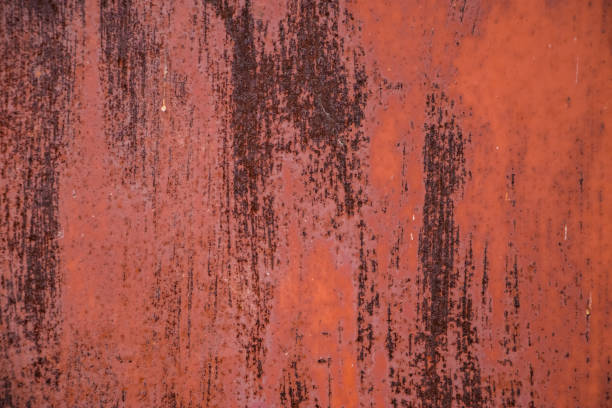 istock Background from rusty metal close-up. Rust spots on iron. 1302512994