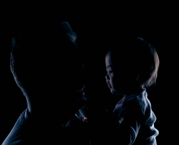istock Father and Infant Daughter Silhouette 1302515669